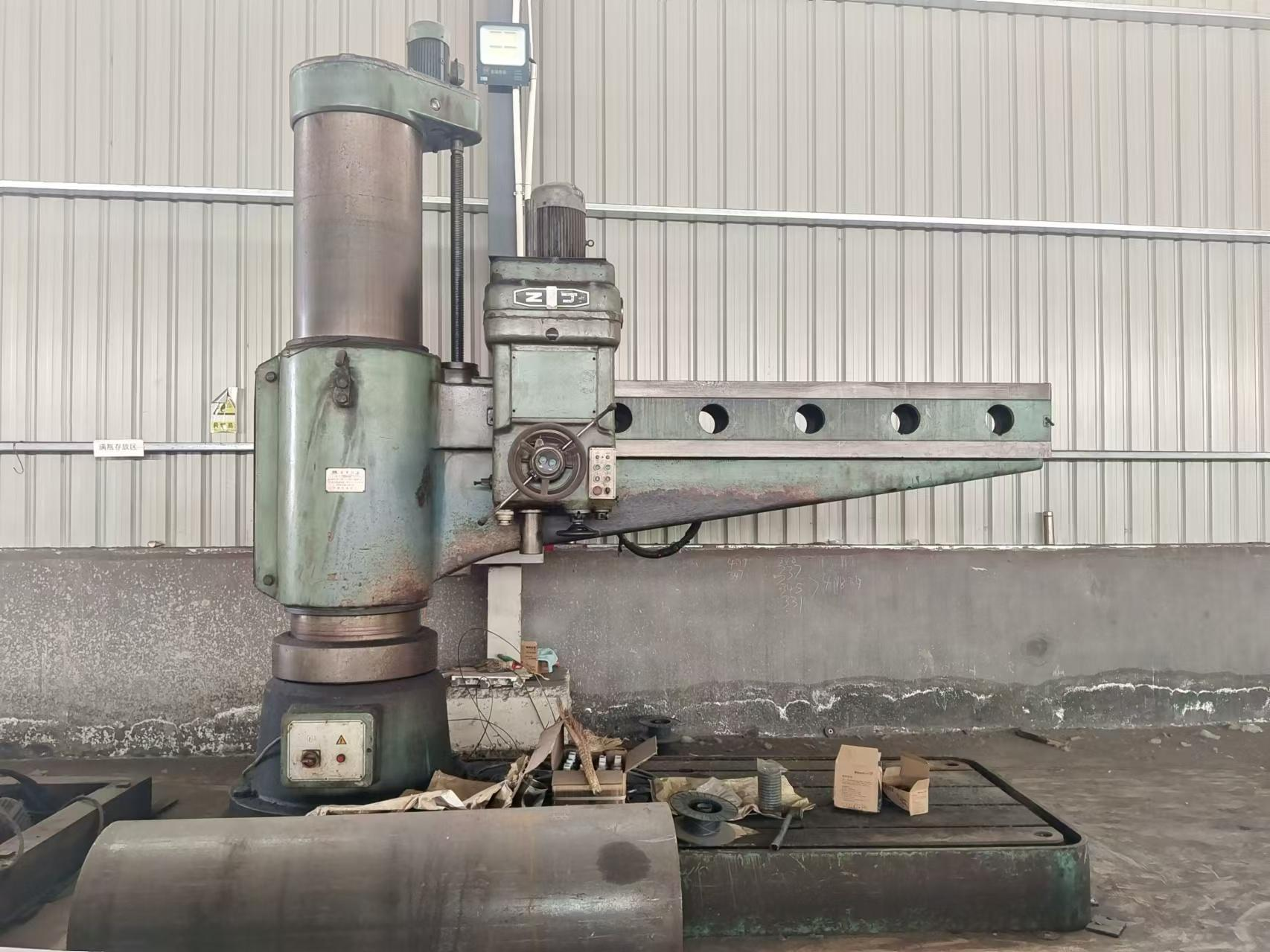 Radial arm drilling machine used for material preparation on steel members