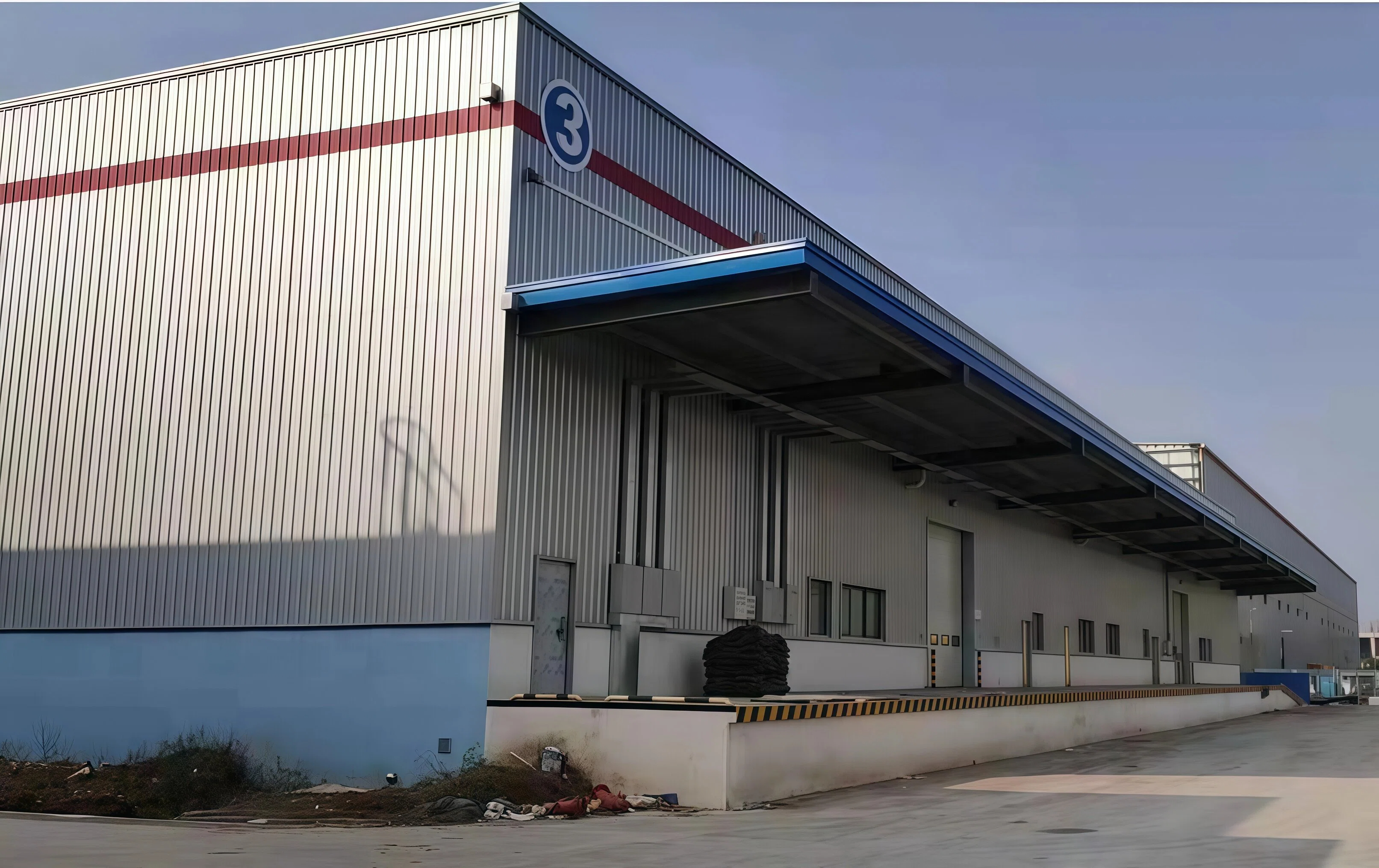 Completed industrial warehouse building exterior with a loading dock canopy